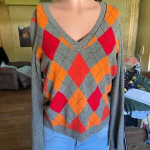 a M, gray and orange and red.